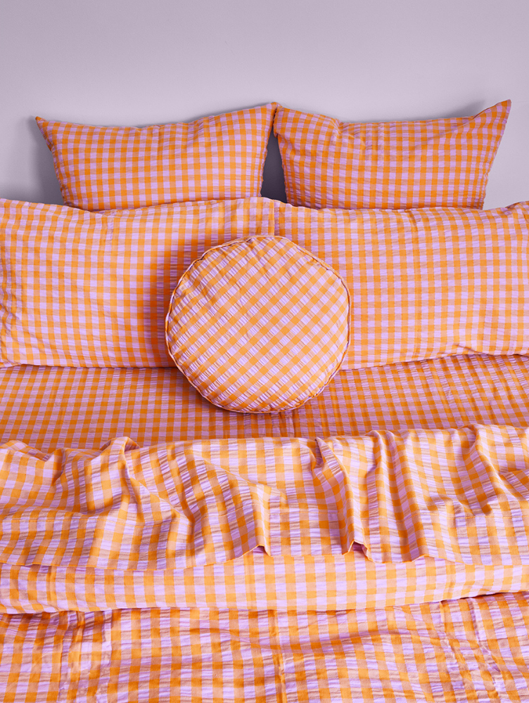 Kumquat Bloom Seersucker Round Cushion by Mosey Me