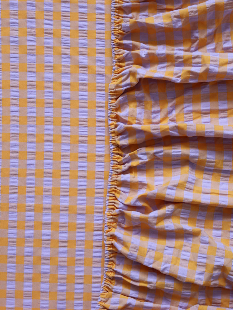Kumquat Bloom Seersucker Fitted Sheet  by Mosey Me